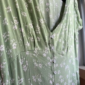 Green dress with white flower print and button front